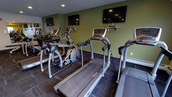 Fitness Center complete with treadmills and other cardio equipment.